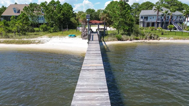 a sign board with yard in the back
