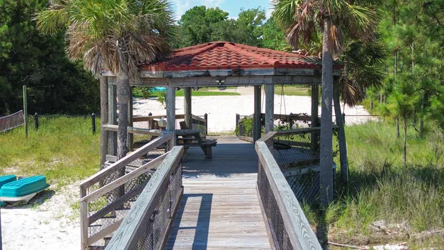 a swimming pool view with a seating space