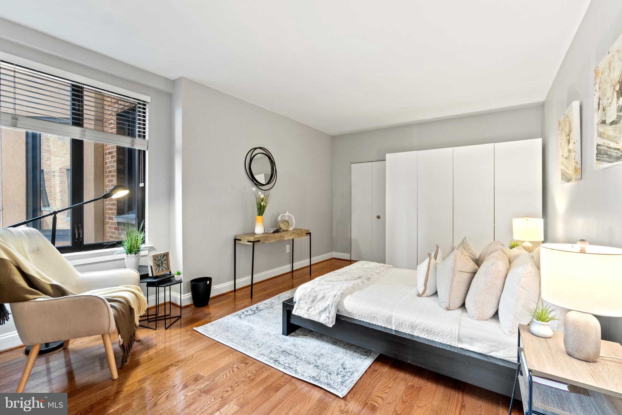 1701 16th Street Northwest, Unit 421 Washington, DC 20009 - Photo 12 of 20 a living room with furniture and a table
