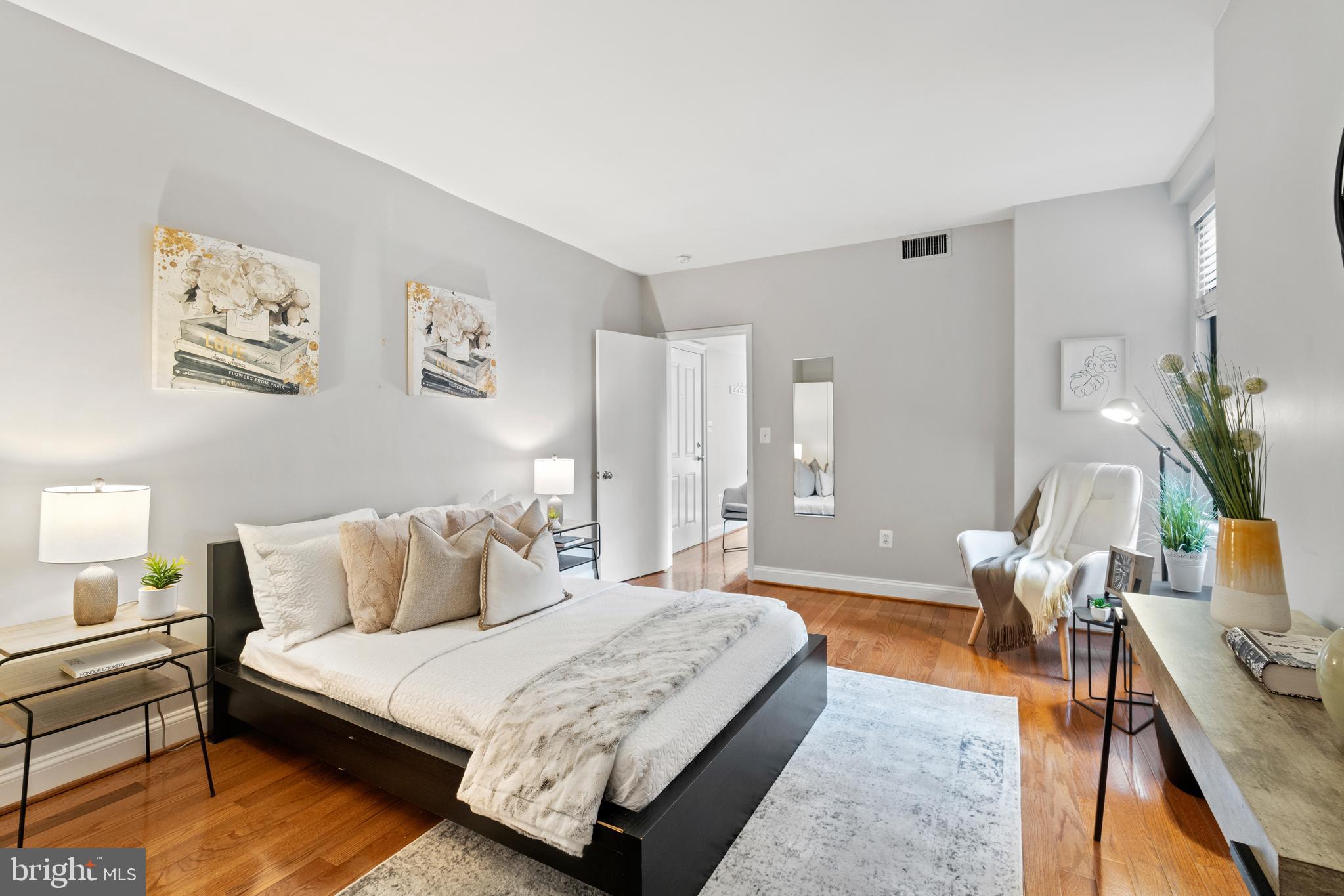 1701 16th Street Northwest, Unit 421 Washington, DC 20009 - Photo 14 of 20 a bedroom with a bed and furniture