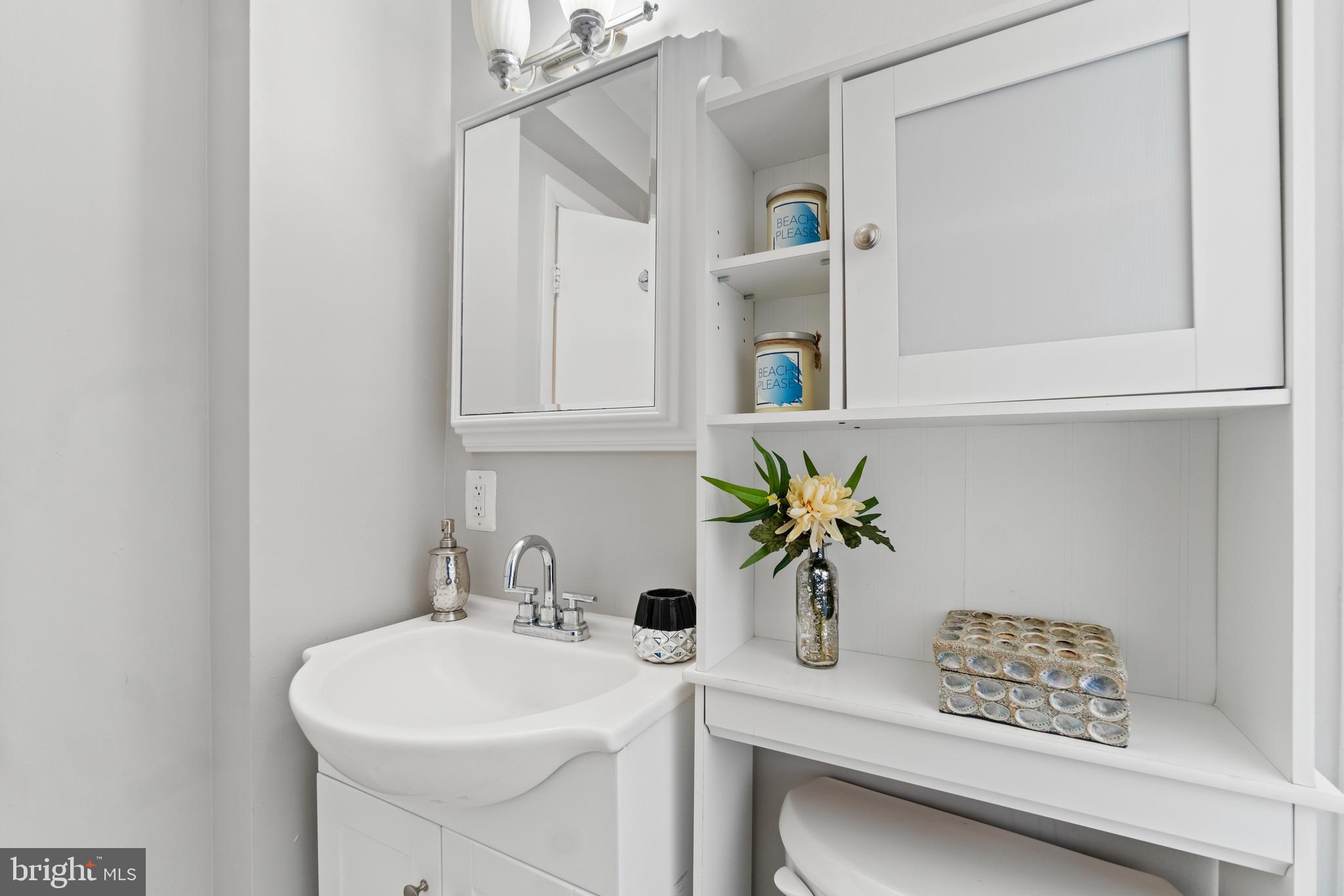 1701 16th Street Northwest, Unit 421 Washington, DC 20009 - Photo 16 of 20 a bathroom with a sink and a mirror