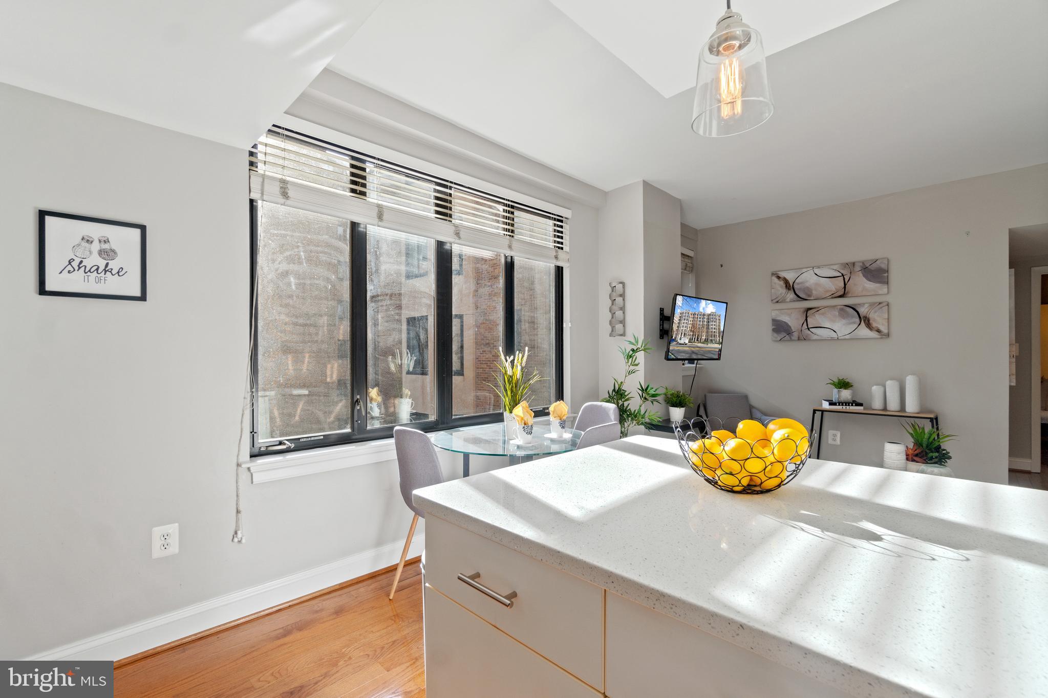 1701 16th Street Northwest, Unit 421 Washington, DC 20009 - Photo 17 of 20 a view of a living room and a window
