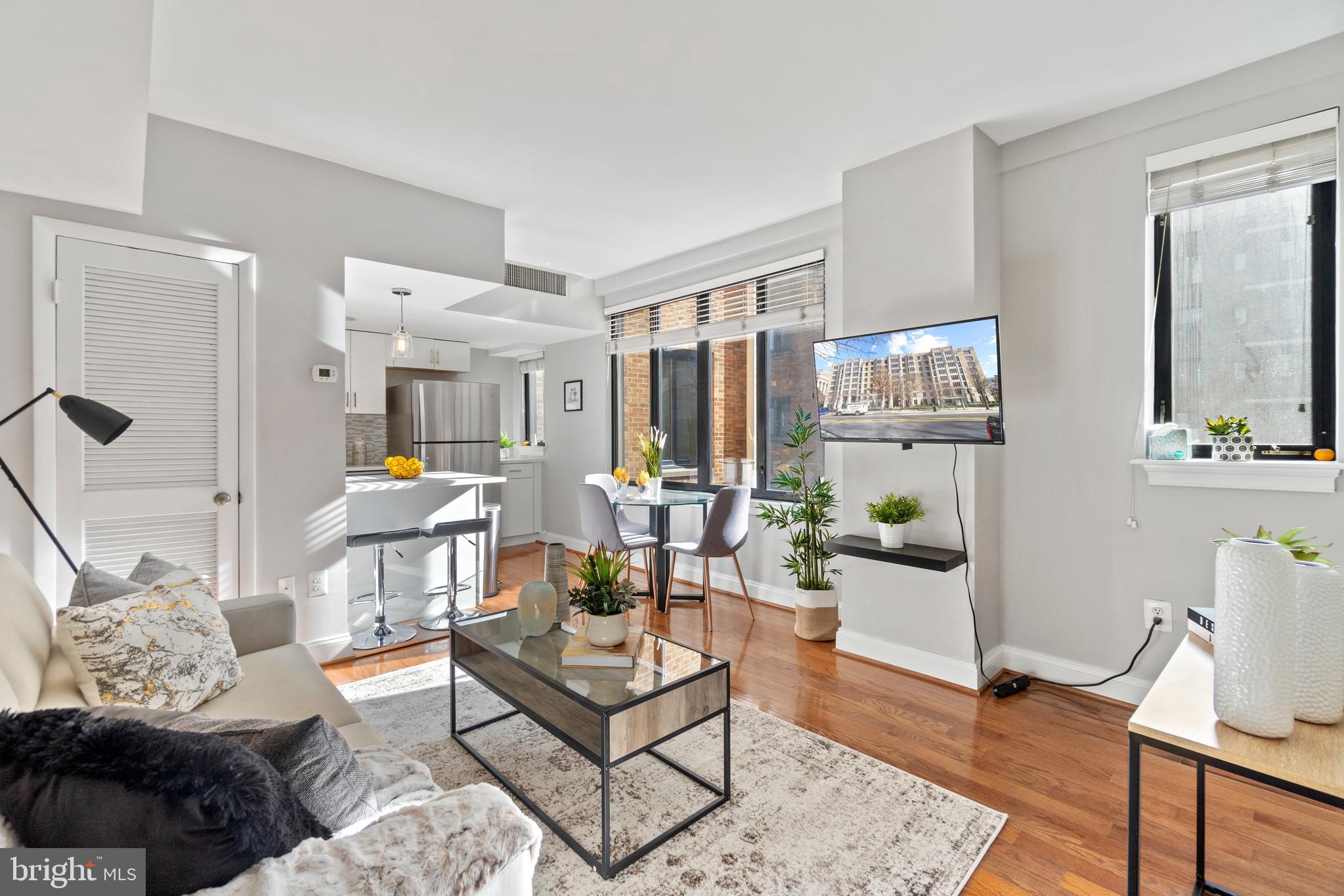 1701 16th Street Northwest, Unit 421 Washington, DC 20009 - Photo 7 of 20 a living room with furniture and wooden floor