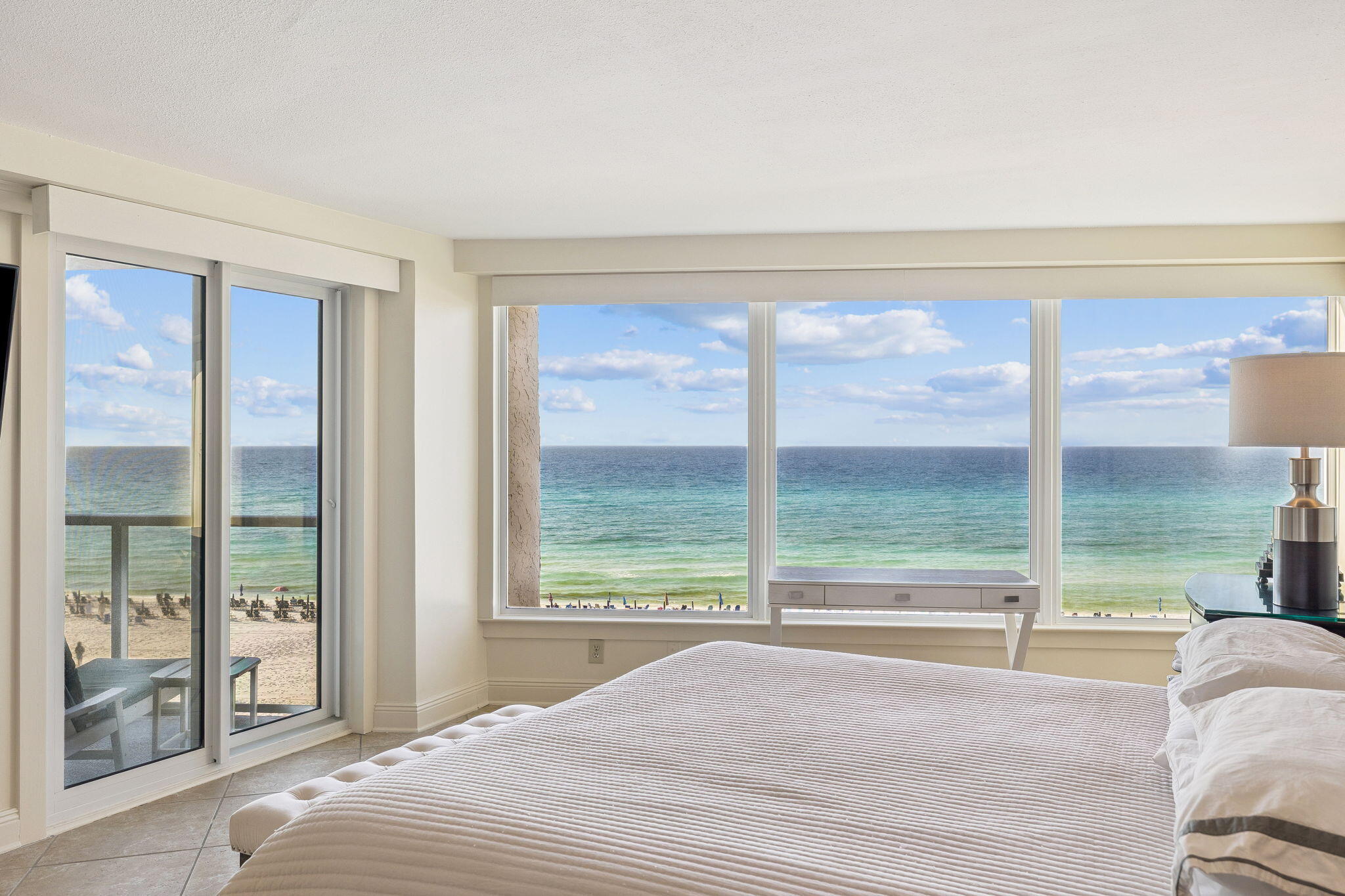 4253 Beachside 2, Unit 4253 Miramar Beach, FL 32550 - Photo 24 of 92 a bedroom with a bed and a large window with balcony view
