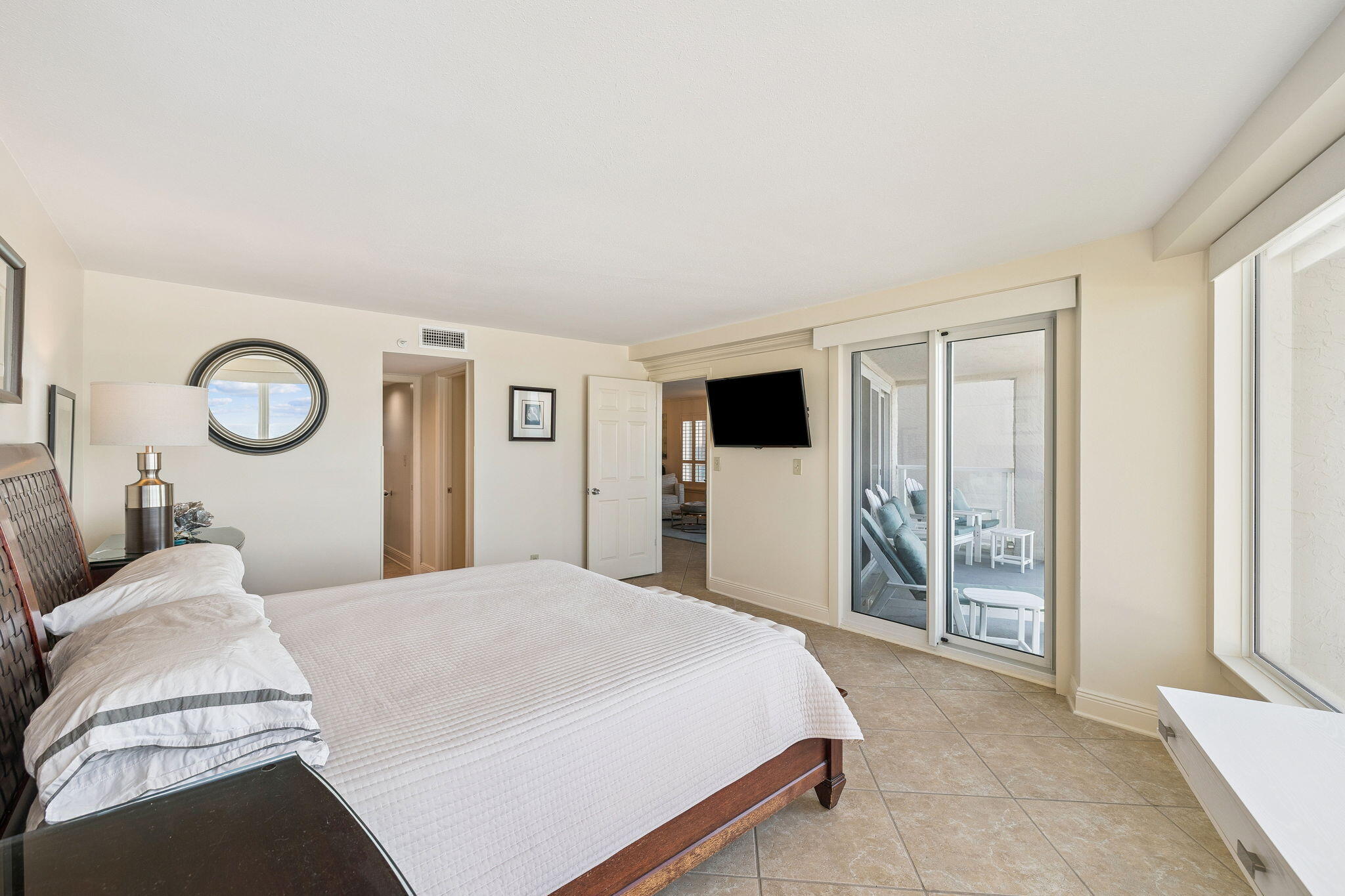 4253 Beachside 2, Unit 4253 Miramar Beach, FL 32550 - Photo 26 of 92 a spacious bedroom with a bed and cabinets
