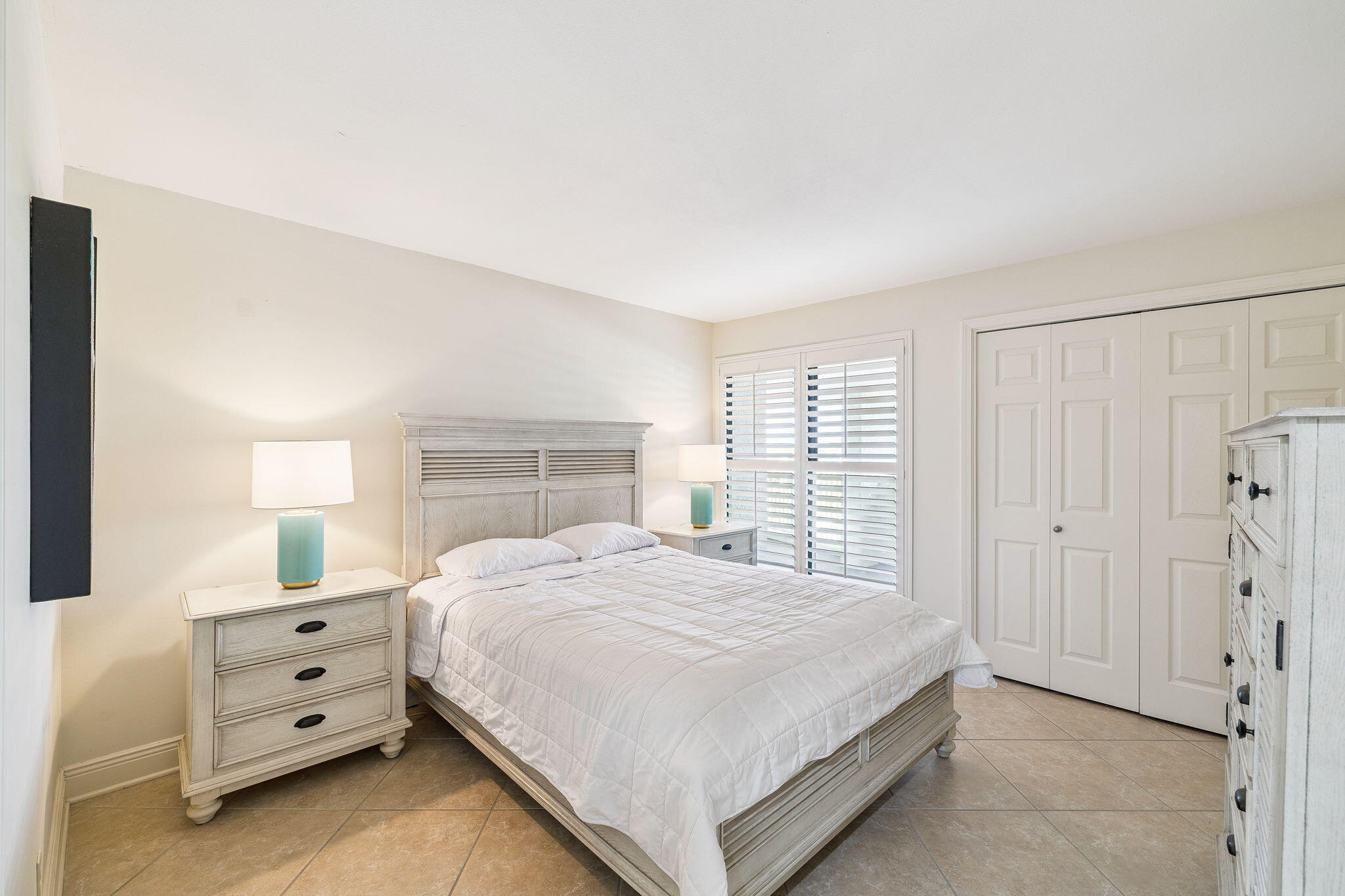 4253 Beachside 2, Unit 4253 Miramar Beach, FL 32550 - Photo 30 of 92 a bedroom with a bed and a window