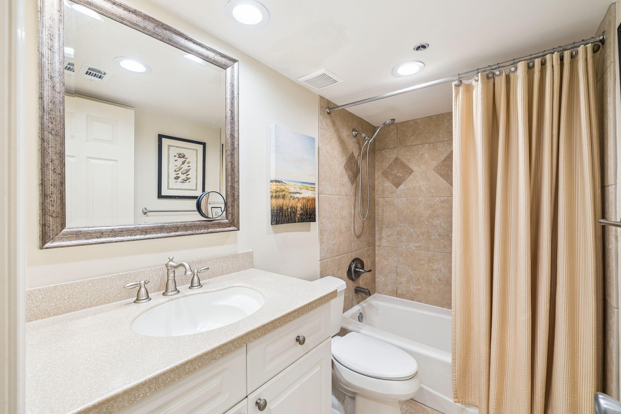 4253 Beachside 2, Unit 4253 Miramar Beach, FL 32550 - Photo 32 of 92 a bathroom with a granite countertop sink toilet and shower