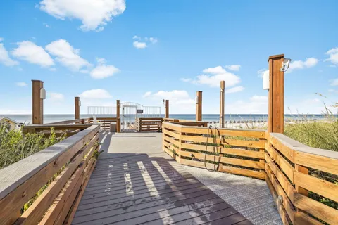 an aerial view of a house with a garden and swimming pool