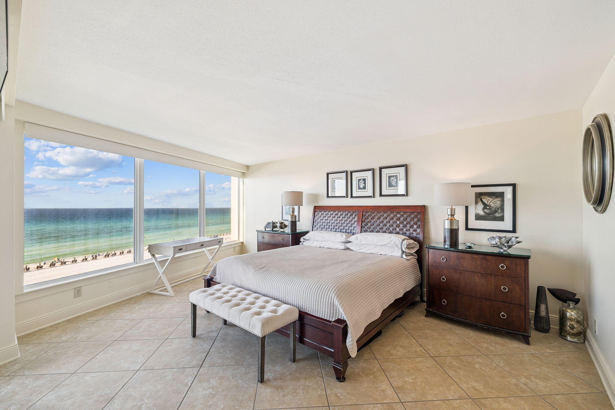4253 Beachside 2, Unit 4253 Miramar Beach, FL 32550 - Photo 4 of 92 a spacious bedroom with a bed and a large window