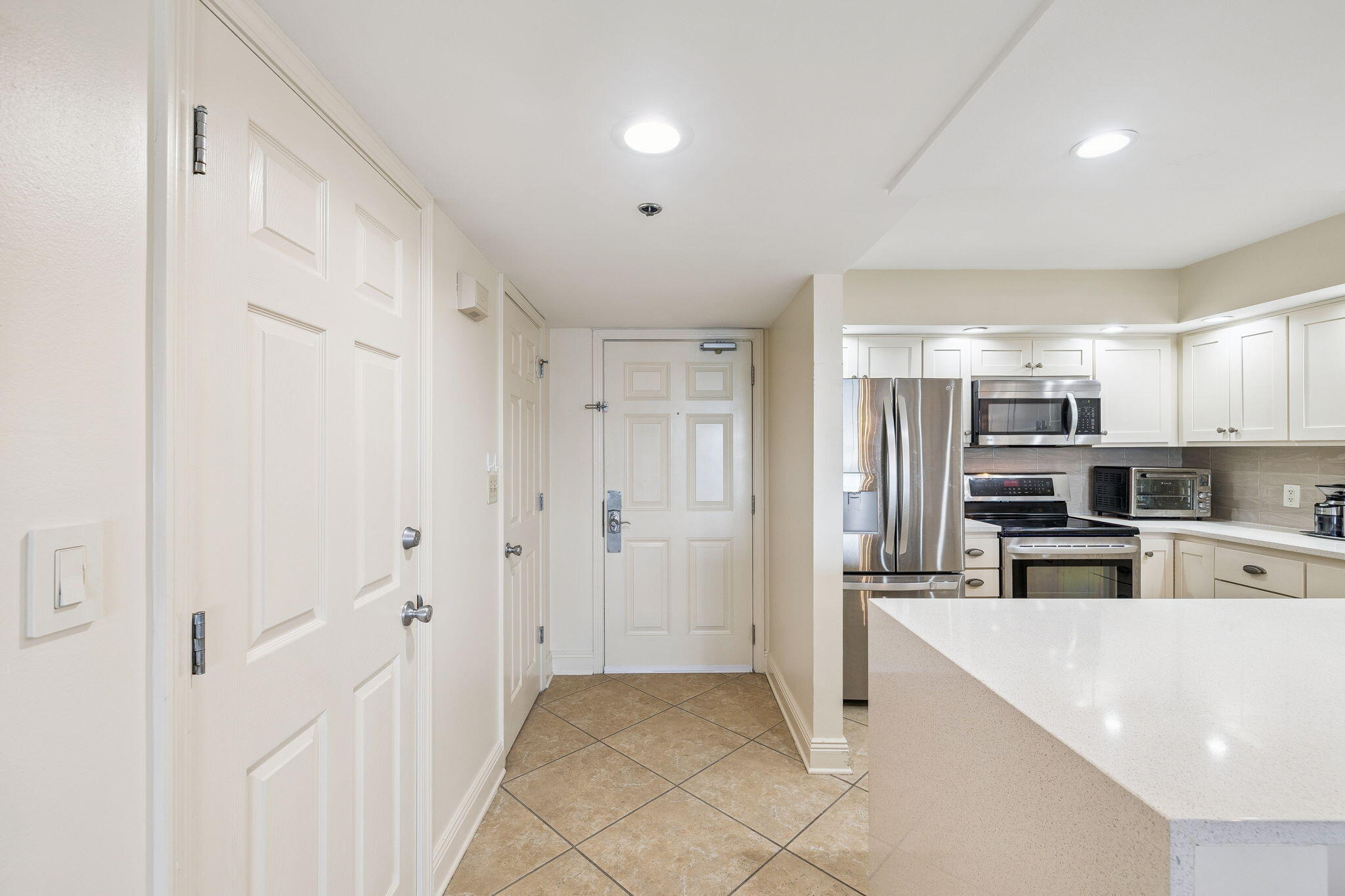 4253 Beachside 2, Unit 4253 Miramar Beach, FL 32550 - Photo 6 of 92 a kitchen with stainless steel appliances refrigerator and cabinets