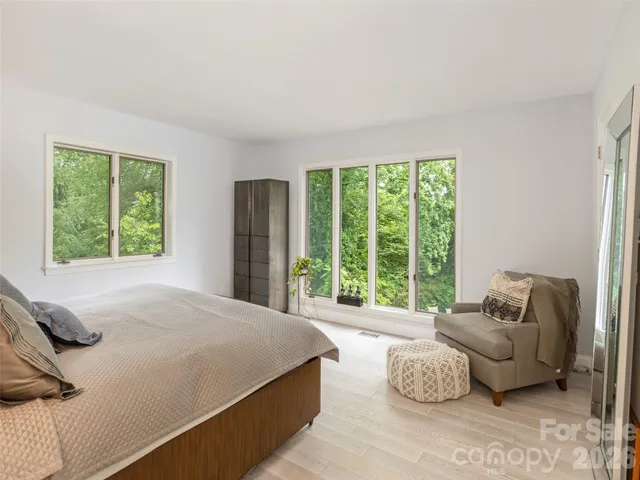 a bathroom with a sink mirror vanity and toilet