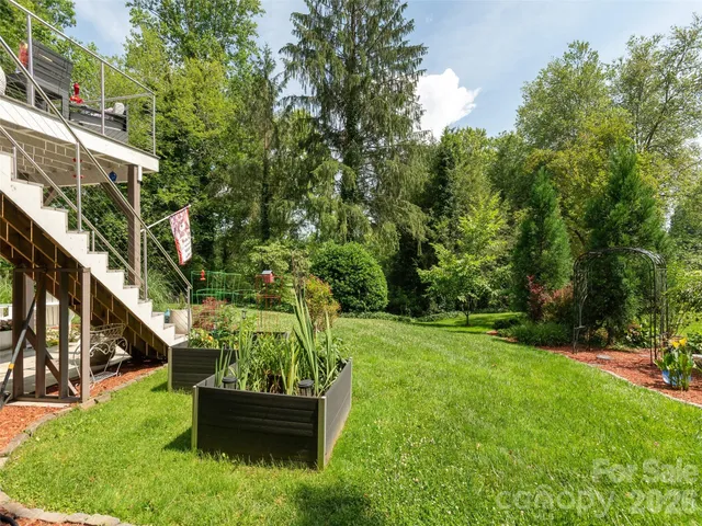 a view of a table and chairs in the garden