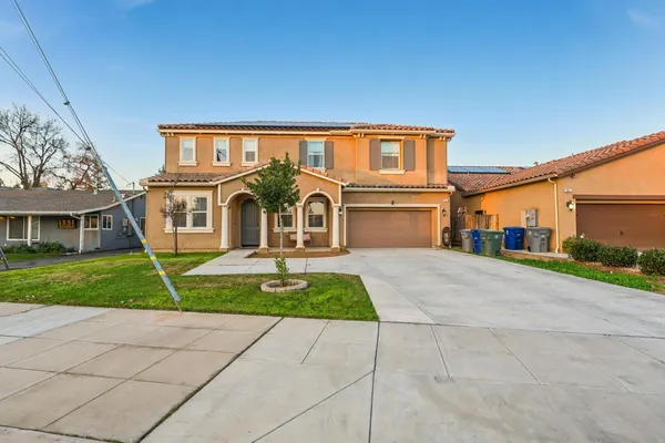 a front view of a house with a yard