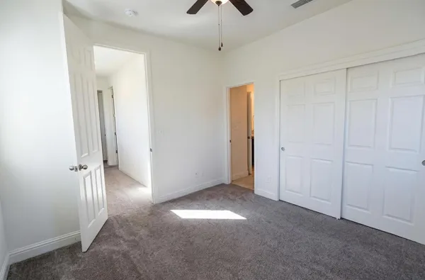 a view of a livingroom with wooden floor and a window