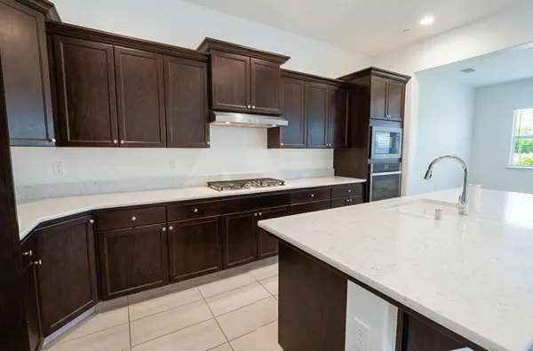 a view of kitchen with cabinets