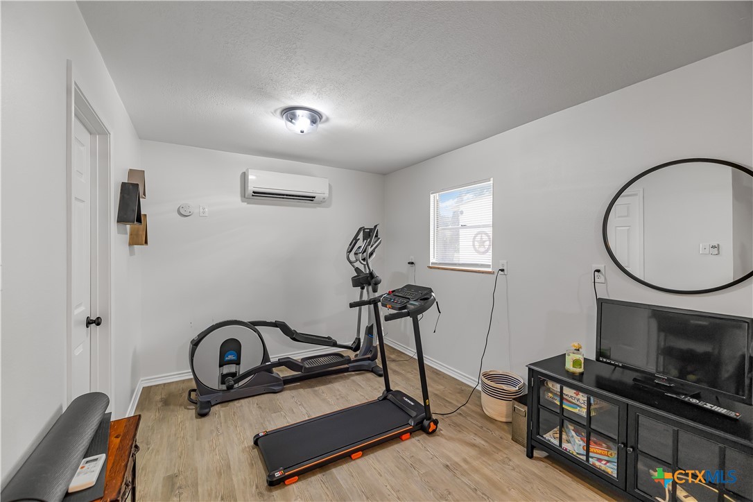 3182 Live Oak Road Cuero, TX 77954 - Photo 29 of 35 The guest house, man cave, she shed, gym... whatever fits your needs. There was once a little kitchenette if you need separate living quarters—it can be converted back.