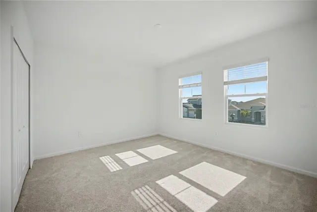 a bathroom with a double vanity sink toilet mirror and bathtub