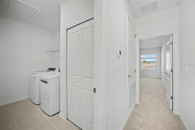 a spacious bathroom with a shower a mirror and a sink