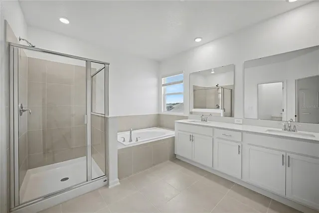 a bathroom with a granite countertop toilet and a shower