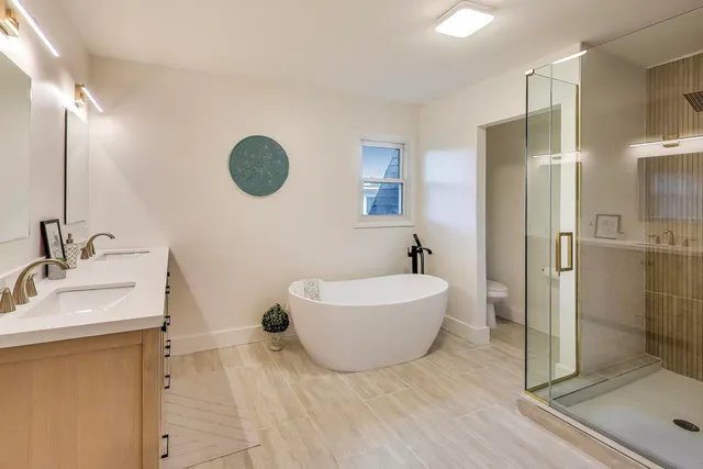 a bathroom with a sink mirror toilet and bathtub
