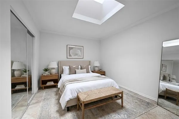 a bedroom with a bed and walk in closet