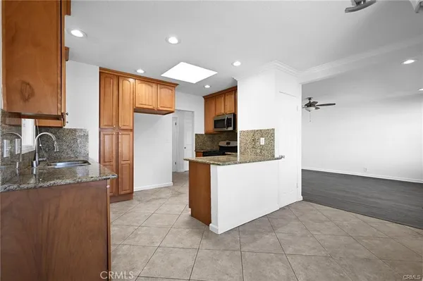 a kitchen with a sink stove and refrigerator