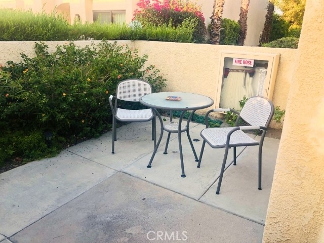 200 East Racquet Club Road, Unit 19 Palm Springs, CA 92262 - Photo 2 of 21 a outdoor space with furniture
