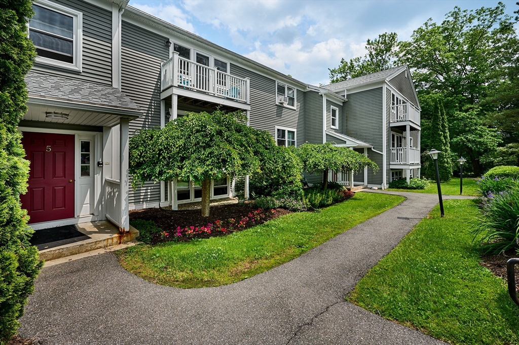48 Evergreen Road, Unit 312 Leeds, MA 01053 - Photo 1 of 22 a front view of a house with a yard