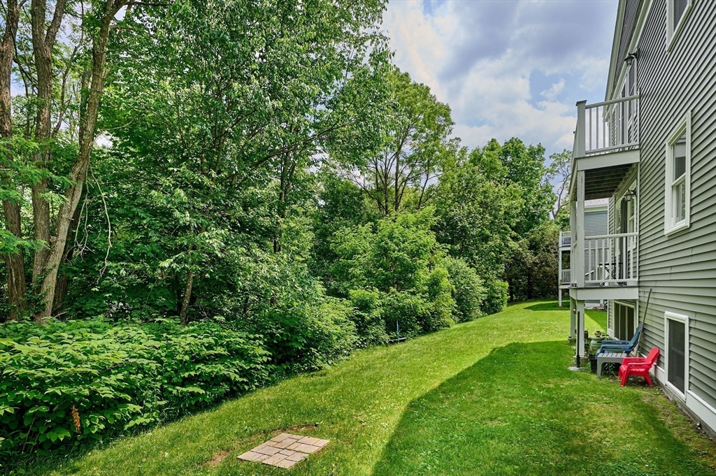 48 Evergreen Road, Unit 312 Leeds, MA 01053 - Photo 21 of 22 a view of yard with swimming pool and green space
