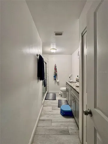 a view of a hallway with seating area