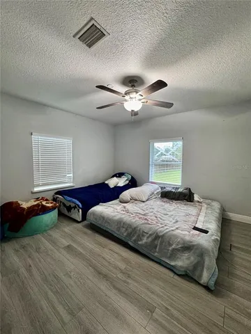 a bedroom with a bed and window