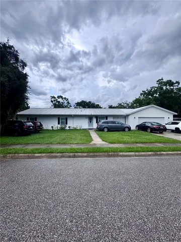 a view of a park with large trees