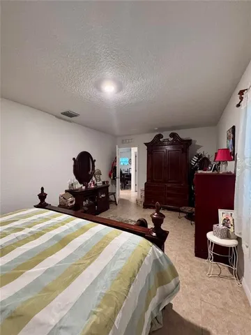 a bed room with a bed and furniture