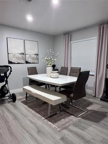 a view of a dining room with furniture