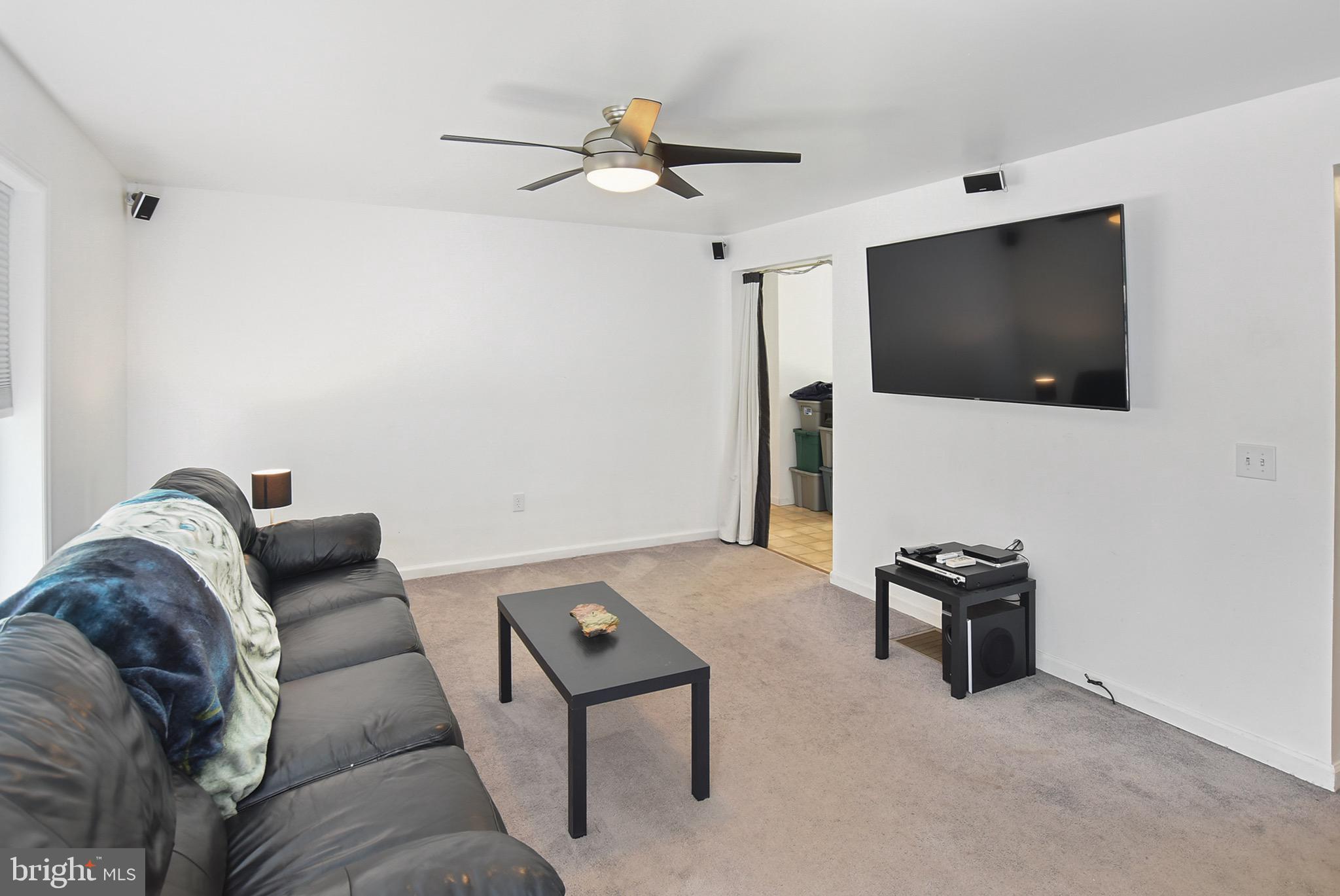 3375 Old Jones Road Dunkirk, MD 20754 - Photo 2 of 38 a living room with furniture and a flat screen tv