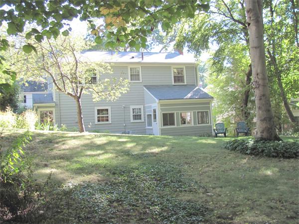 50 Clearwater Road Brookline, MA 02467 - Photo 14 of 16 a view of a yard in front of a house with large trees