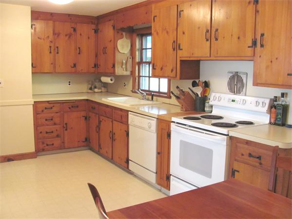 50 Clearwater Road Brookline, MA 02467 - Photo 4 of 16 a kitchen with stainless steel appliances granite countertop a stove a sink and a microwave