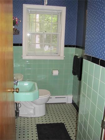 50 Clearwater Road Brookline, MA 02467 - Photo 6 of 16 a bathroom with a sink and a toilet