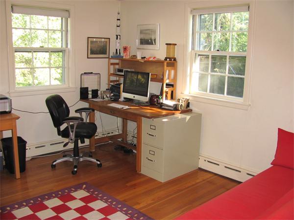 50 Clearwater Road Brookline, MA 02467 - Photo 7 of 16 a view of a workspace with furniture and a window