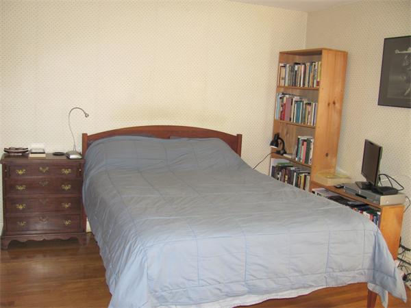 50 Clearwater Road Brookline, MA 02467 - Photo 10 of 16 a bedroom with a bed and a flat screen tv