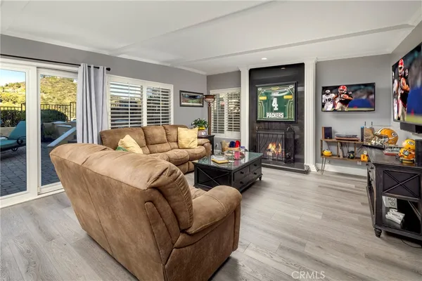 a living room with furniture and a fireplace