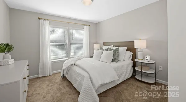 a room with a window and flowerpot