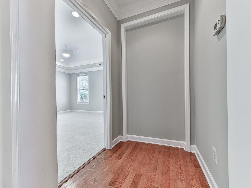 626 Laurel Crossing Canton, GA 30114 - Photo 27 of 77 a view of a hallway with wooden floor