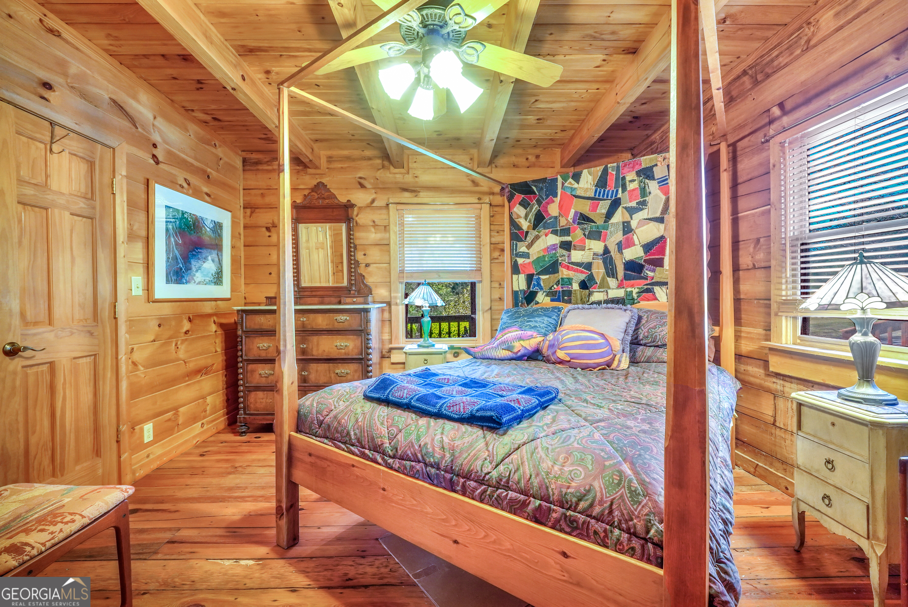 330 Country Kitchen Road Barnesville, GA 30204 - Photo 39 of 64 a bed room with a bed and a painting on the wall