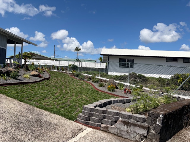 856 Ho'olala Place Hilo, HI 96720 - Photo 2 of 30 a view of a yard with plants and outdoor seating