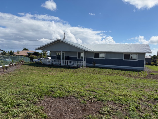 856 Ho'olala Place Hilo, HI 96720 - Photo 3 of 30 a front view of a house with a garden