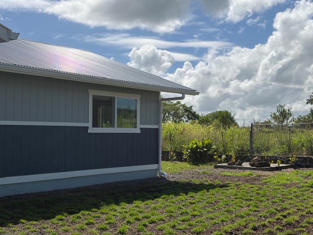 856 Ho'olala Place Hilo, HI 96720 - Photo 4 of 30 a backyard of a house with lots of green space