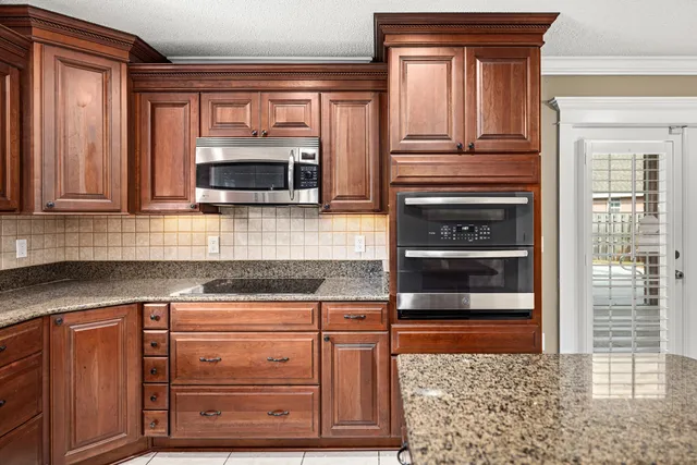 a bedroom with a large bed and a dresser