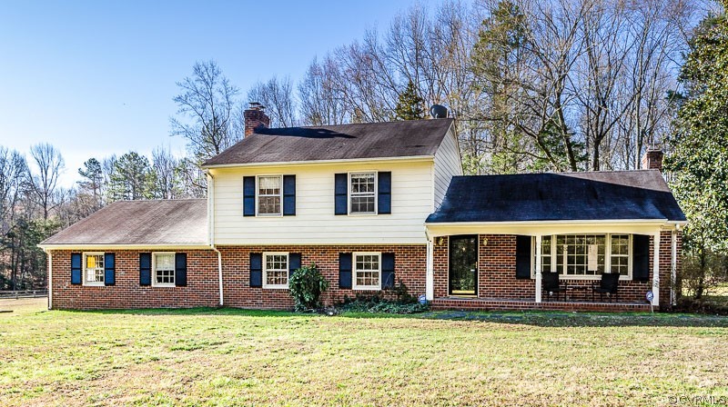 1261 Cardwell Road Crozier, VA 23039 - Photo 3 of 50 a front view of a house with a yard