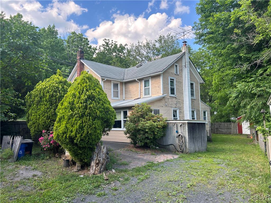 6236 Neola Road Stroudsburg, PA 18360 - Photo 2 of 3 a front view of a house with garden